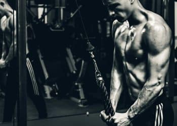 grayscale photo of man exercising